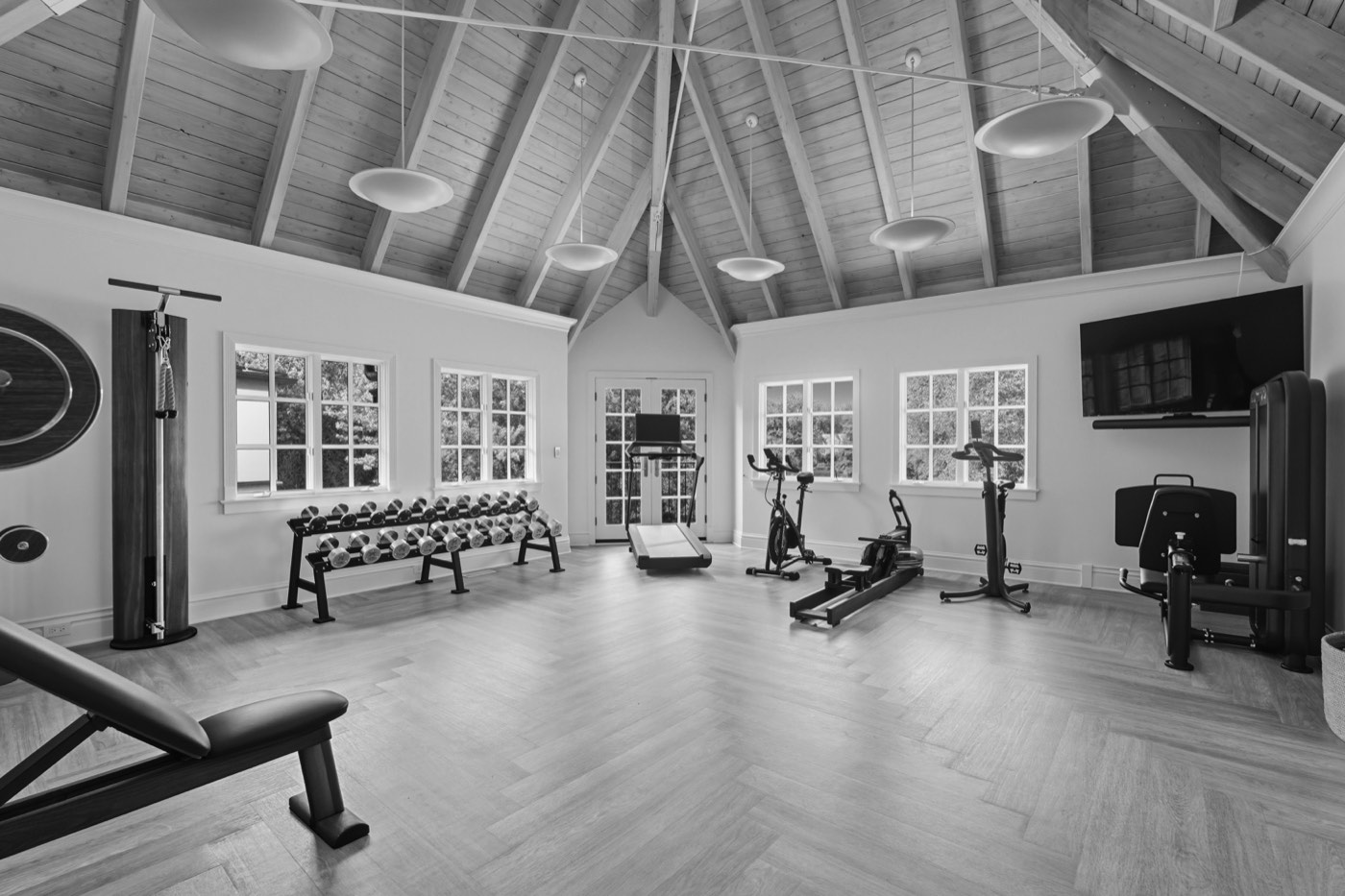 Luxury home gym with vaulted ceilings in Winnetka IL, designed and built by CS Gym Design